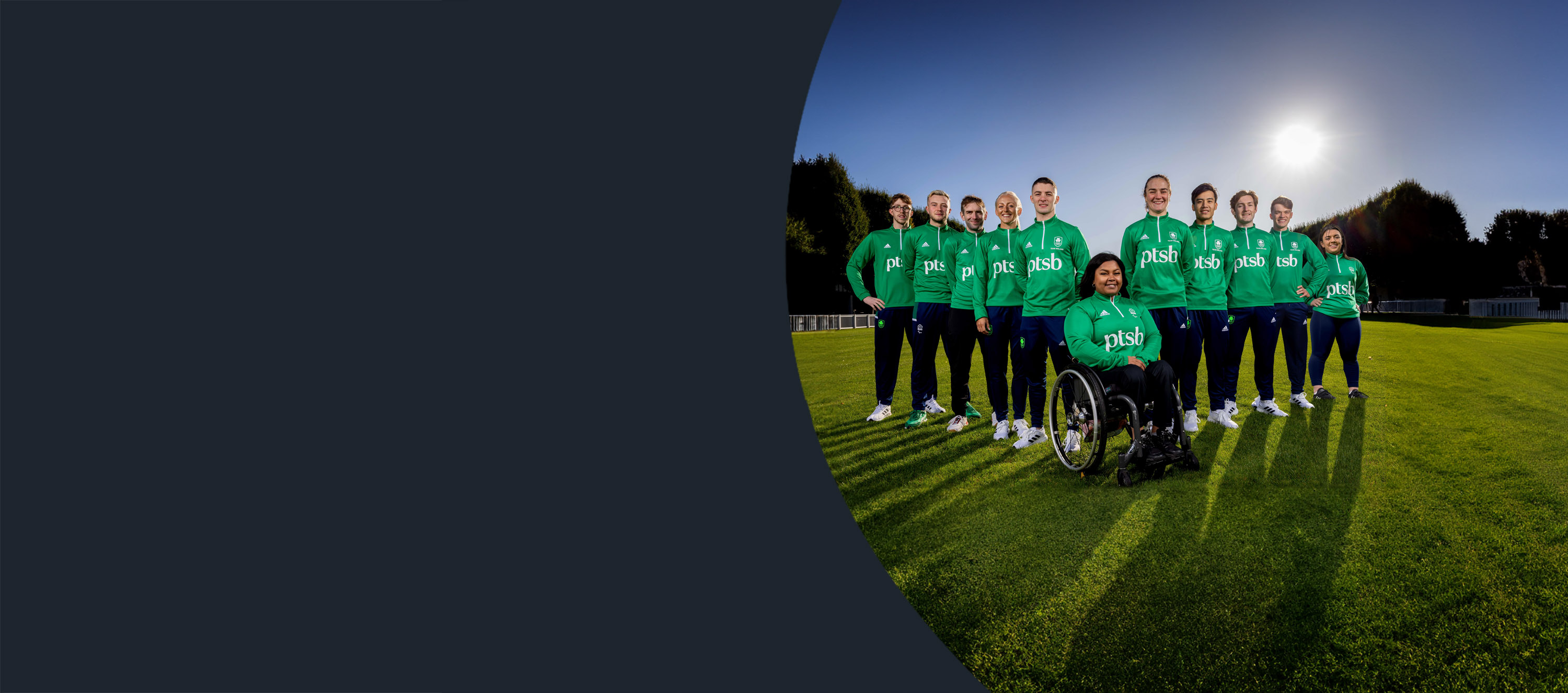 The PTSB Paralympians ad Olympians  ambassadors standing as a group in a field